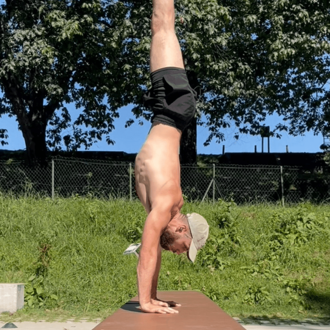 a person doing handstand